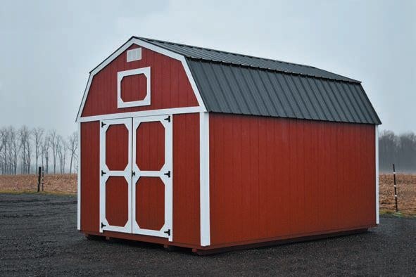 A red lofted barn with white trim