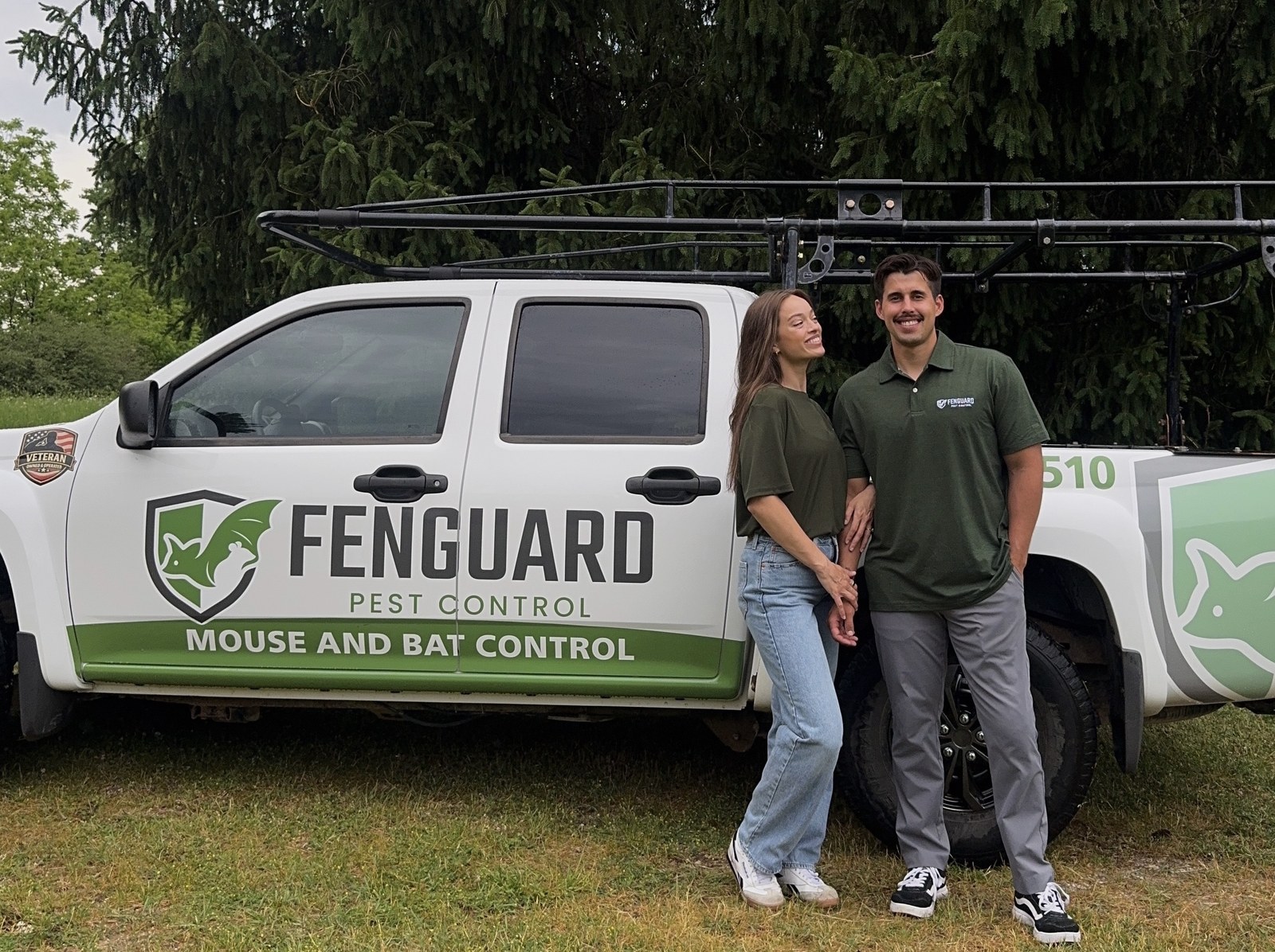Krissy and Nick standing beside the FenGuard truck, lettered Mouse and Bat Control