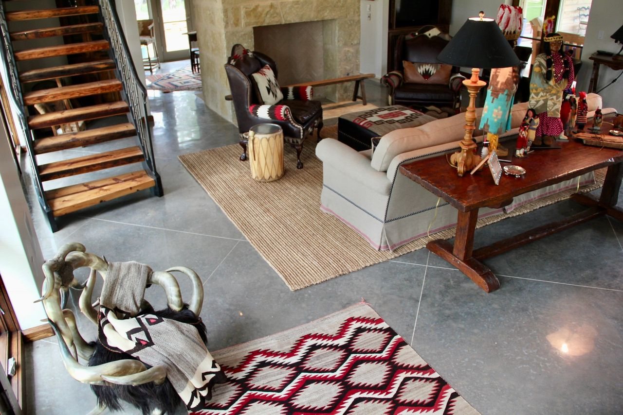 A grey finished concrete floor in a living room