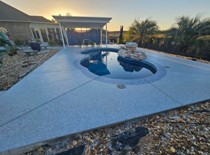 A coated pool deck at sunset