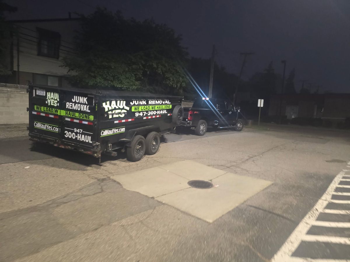 The Haul Yes truck and trailer in a parking lot at night