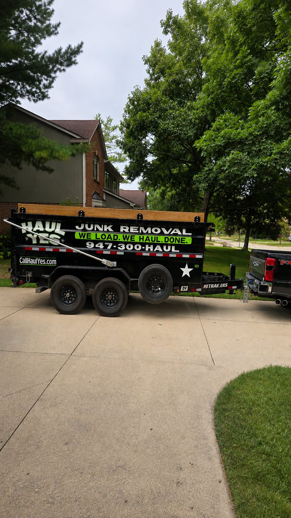 The Haul Yes dump trailer in a residential driveway