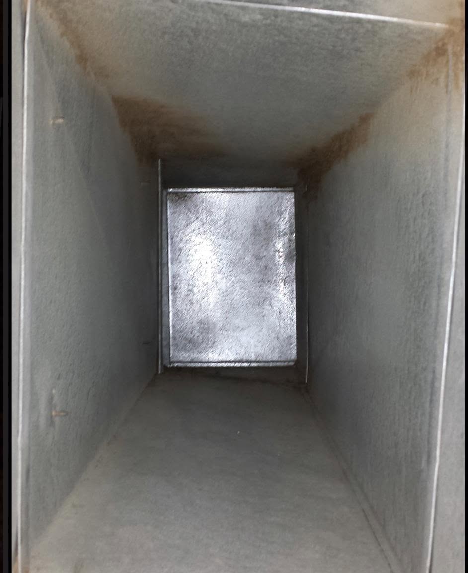 A supply vent, wall to wall buildup after cleaning