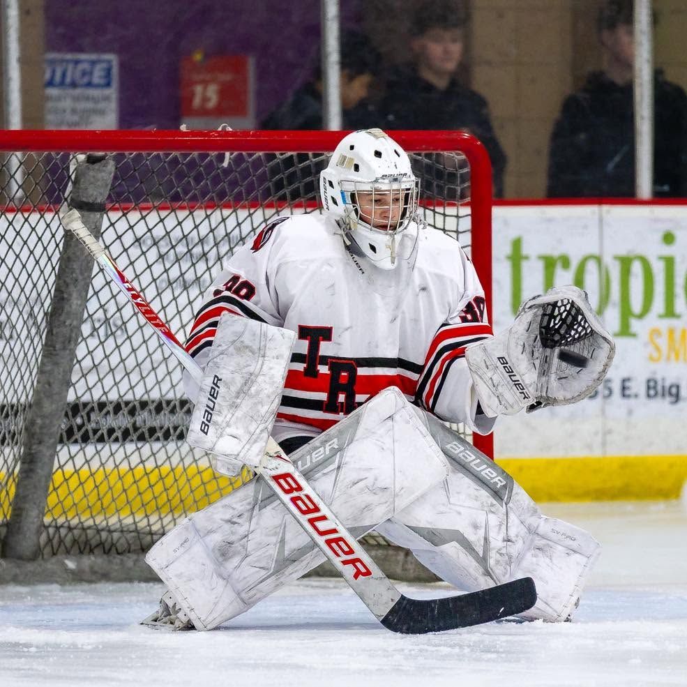 A hockey goalie in the crease