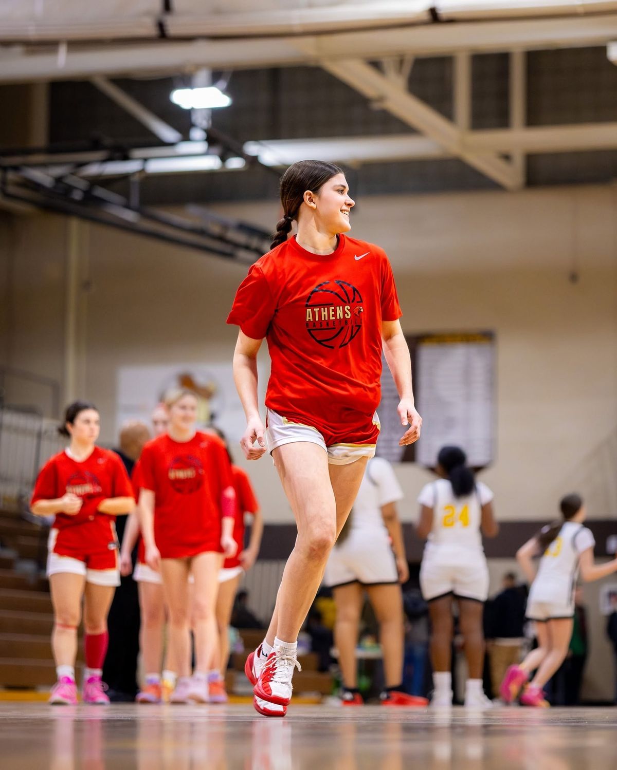 A girls' basketball player in red
