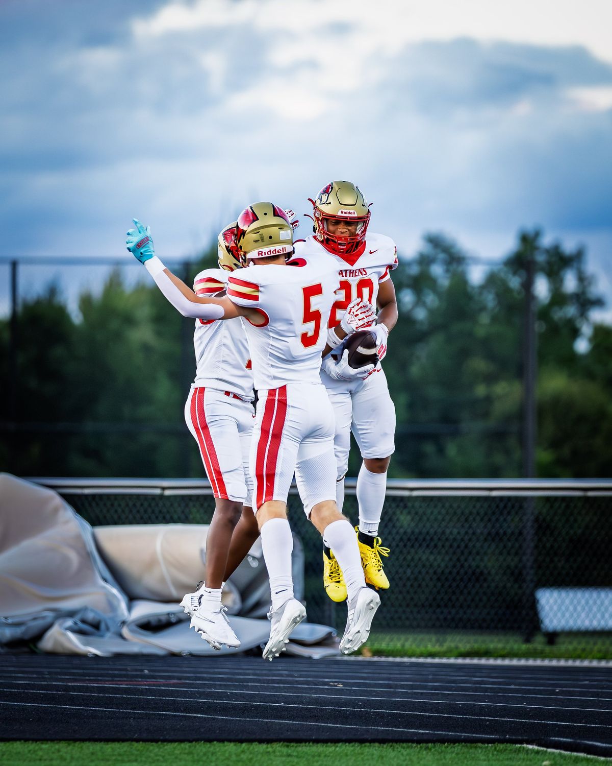 Two football players embracing after a play