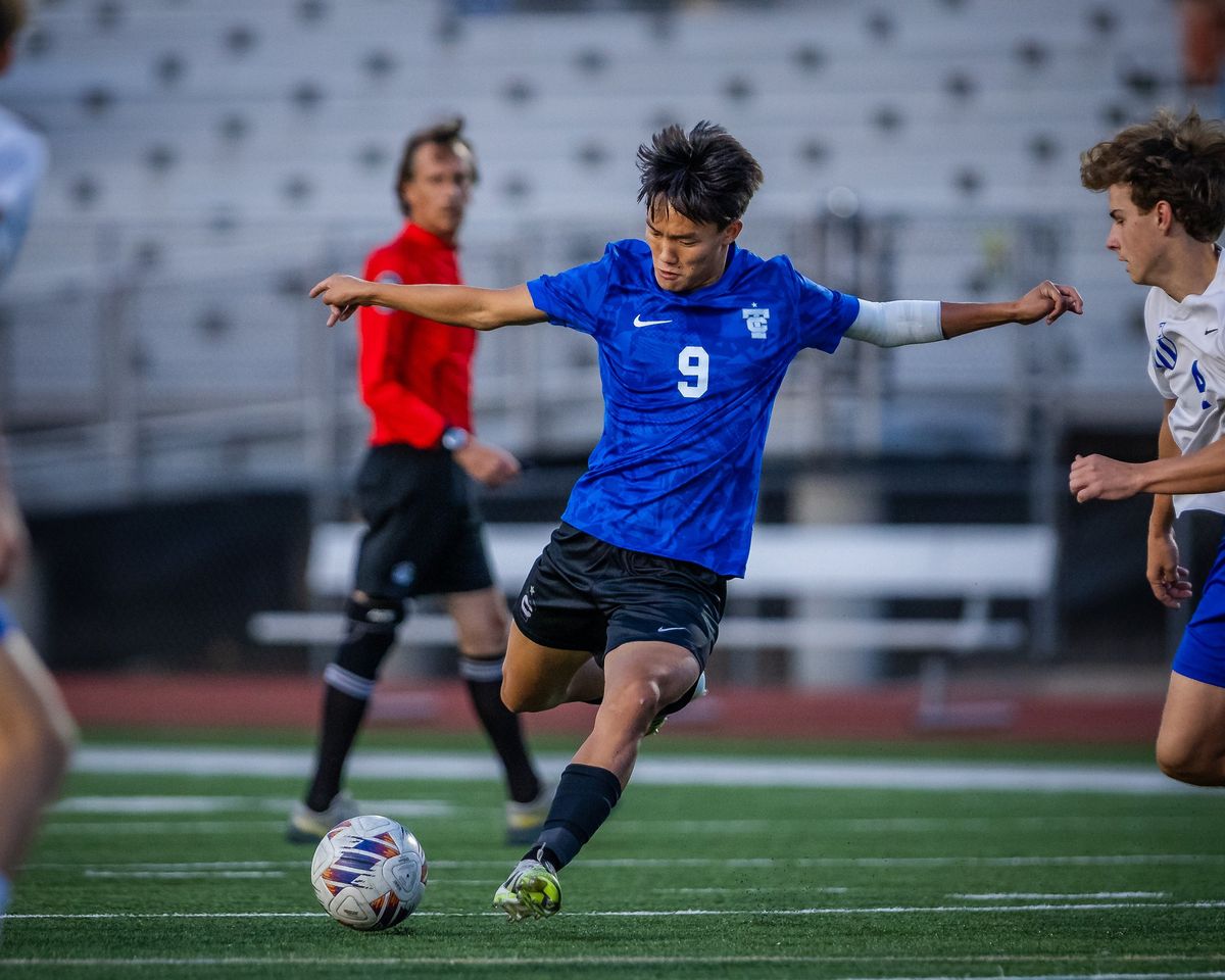 A soccer player striking the ball
