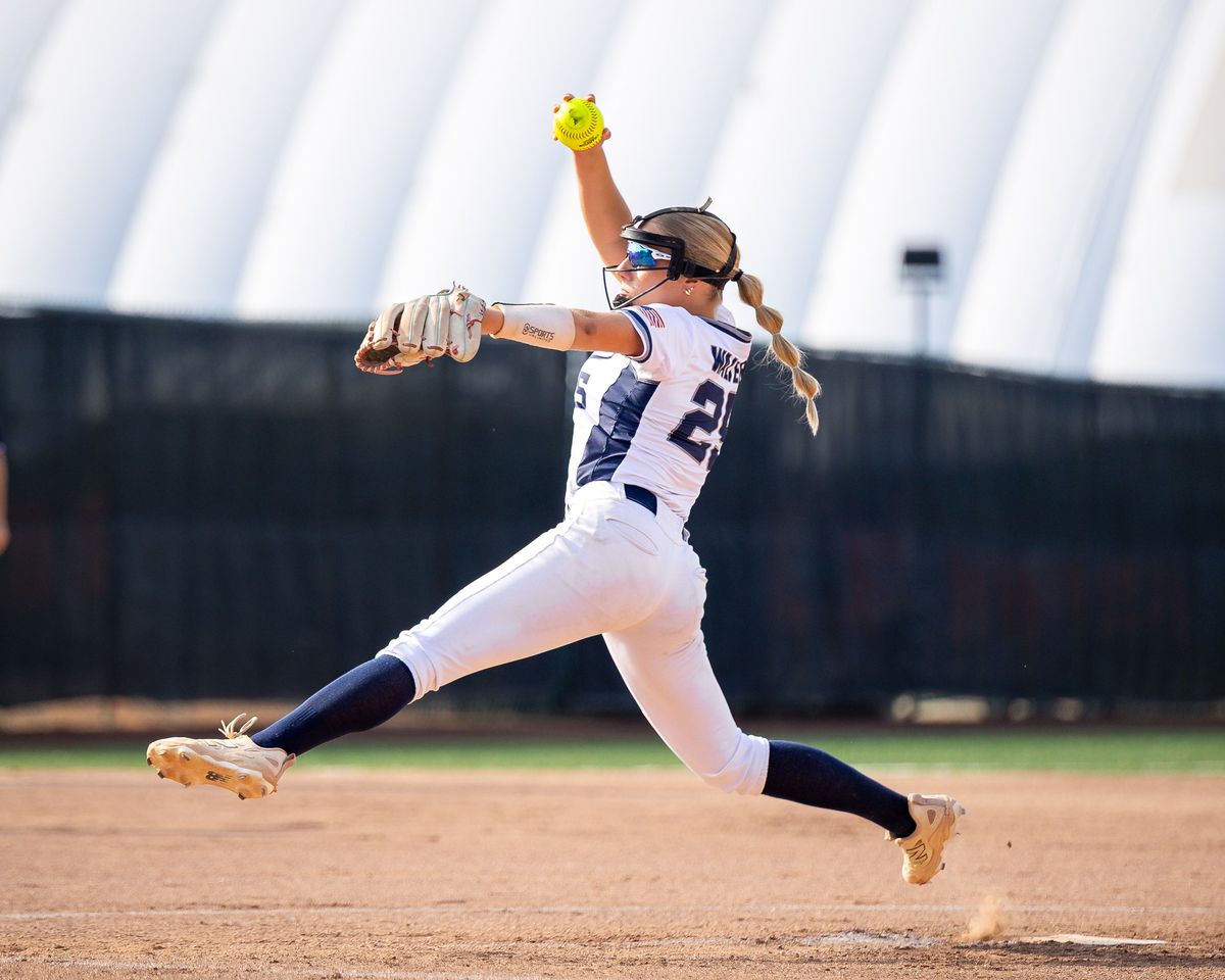 A softball pitcher at the release