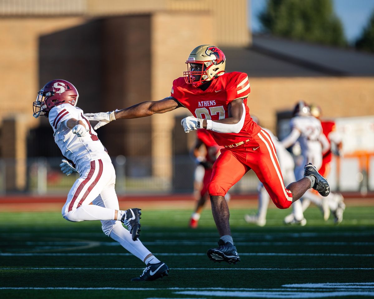 A football player breaking a tackle