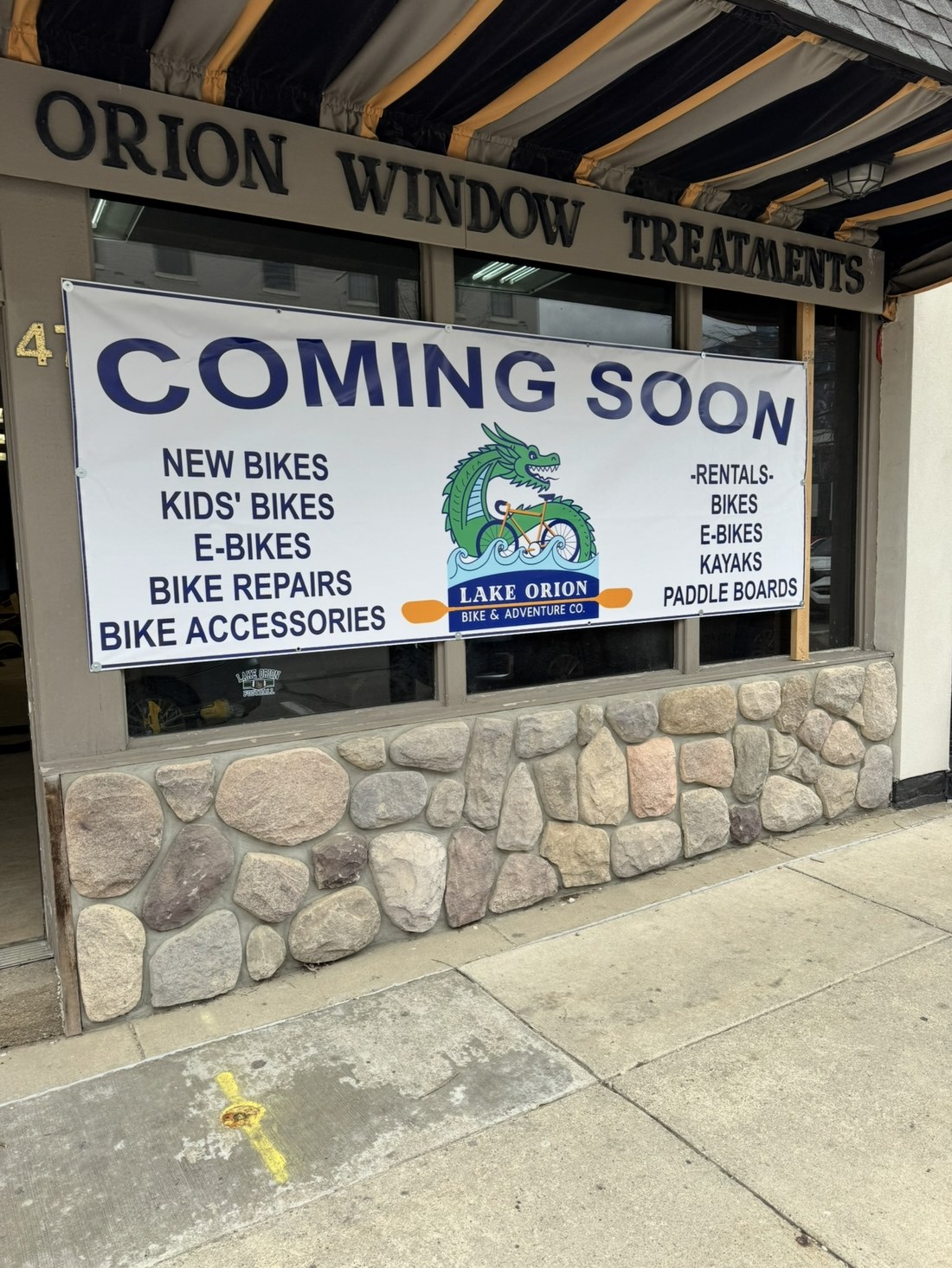 Coming soon sign in the window: new bikes, kids' bikes, e-bikes, rentals, repairs