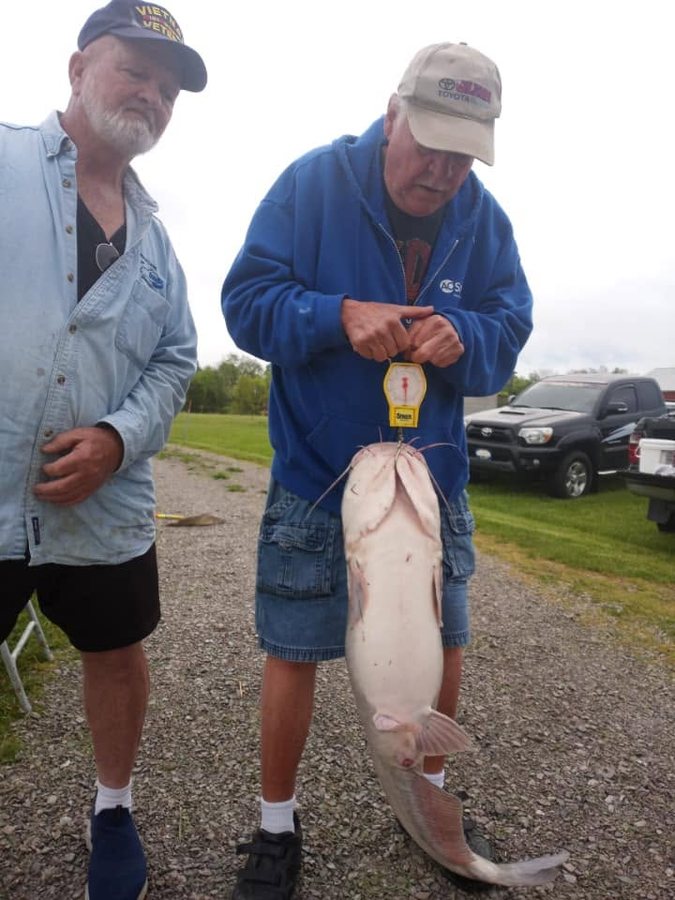 Two regulars weighing in a catfish
