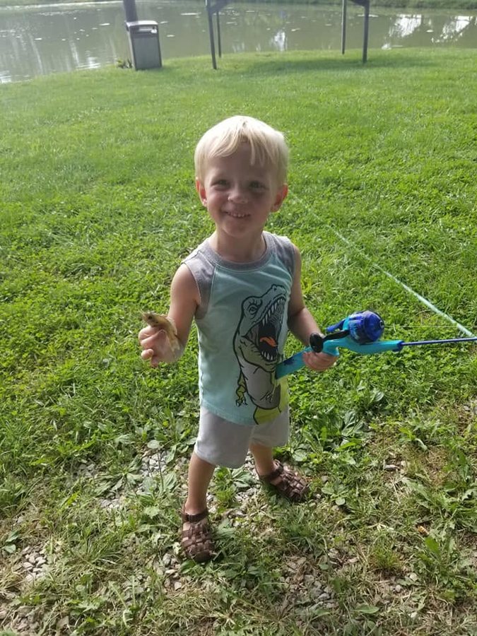 A toddler with his first fishing rod