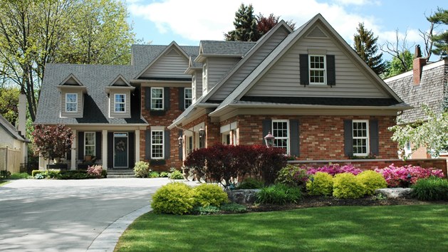 A finished driveway at a brick colonial home