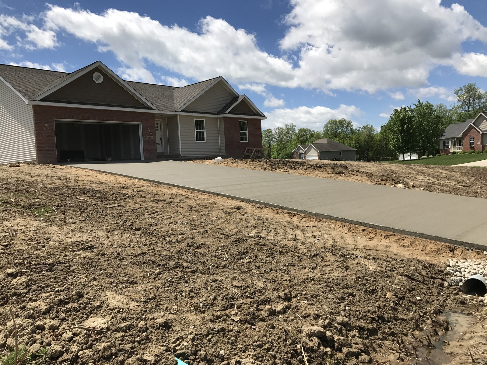 A new driveway at a newly built ranch home