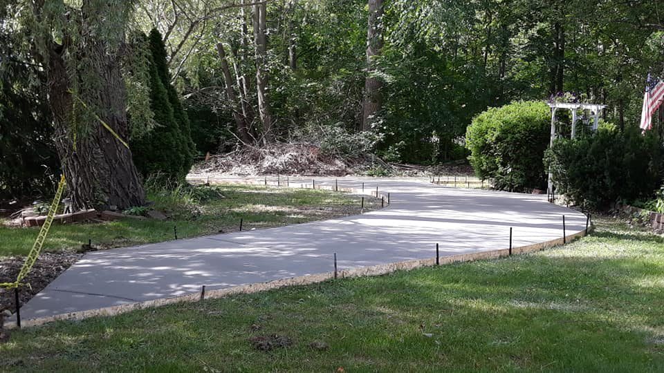 A curved walkway, formed and freshly poured
