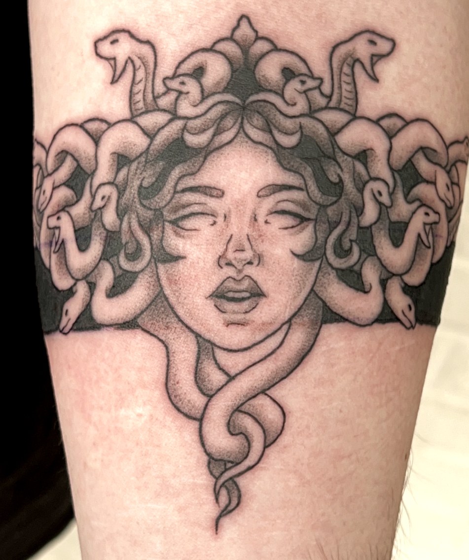 Fine line Medusa with a crown of snakes and dotwork shading