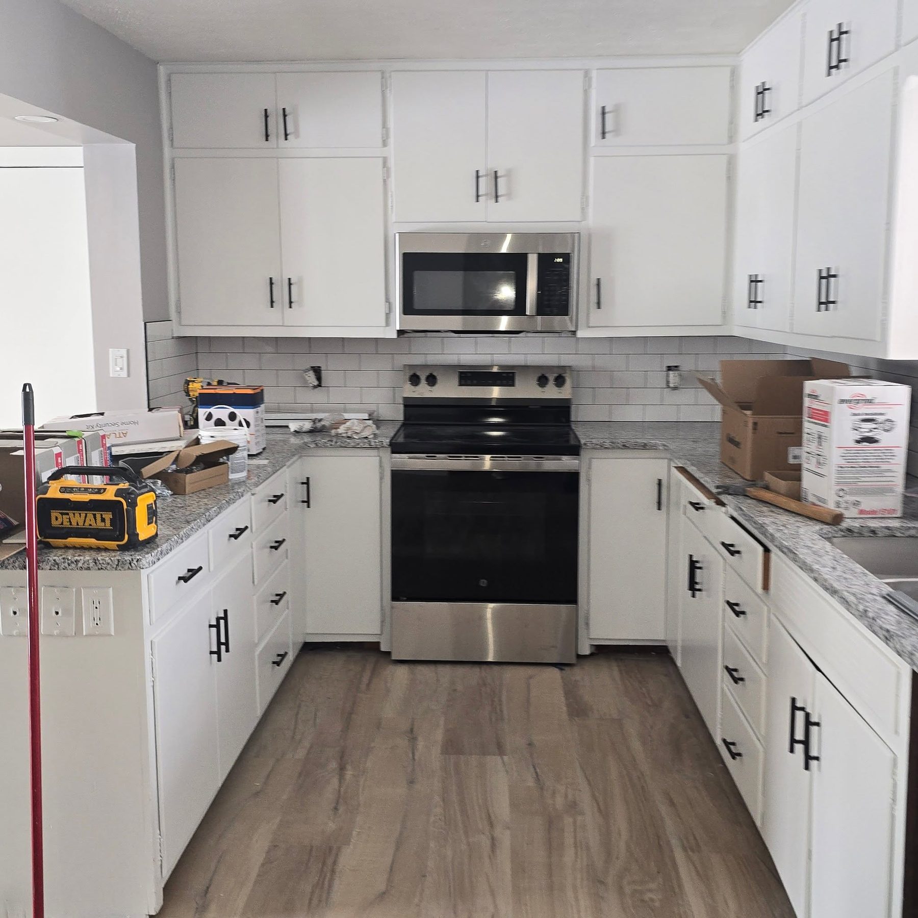 A freshly painted Grand Island kitchen with crisp white cabinets