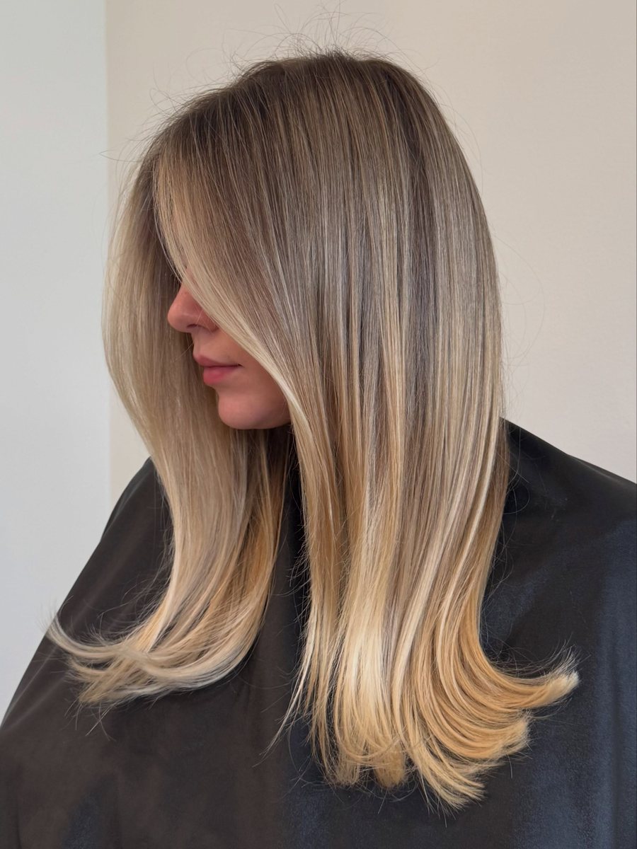 Long blended blonde with face-framing pieces