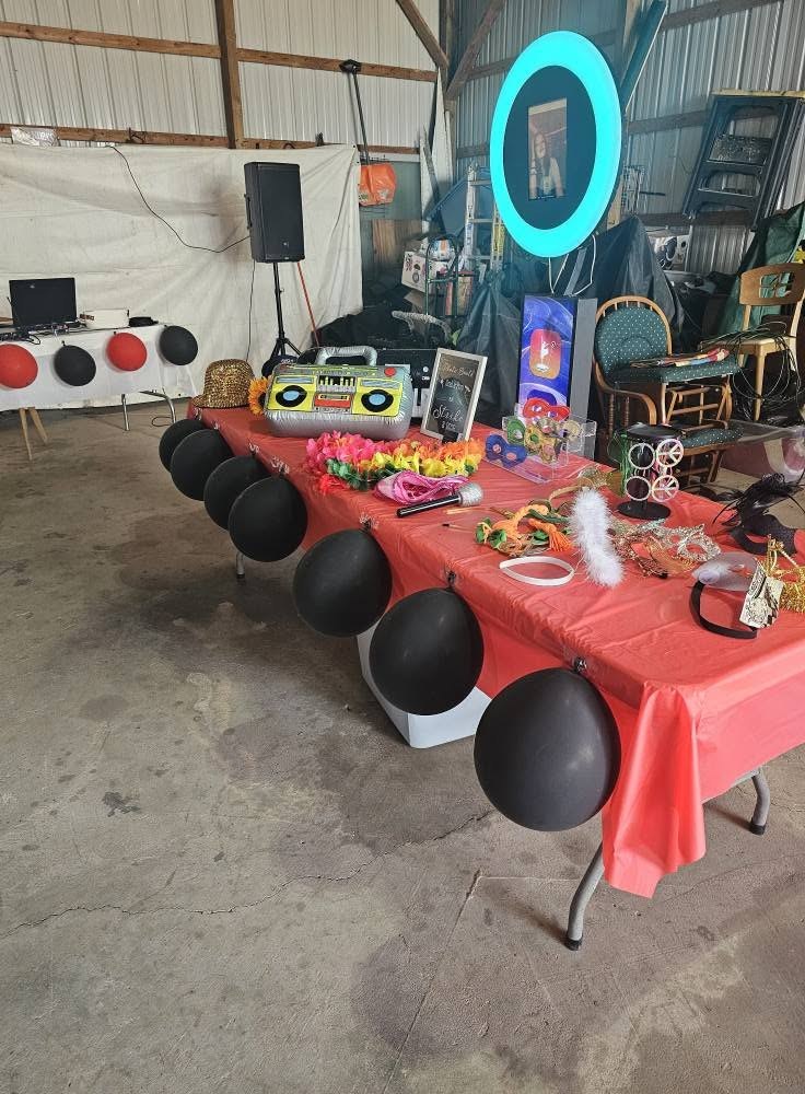 The ring-light booth and decorated tables at a Sweet 16