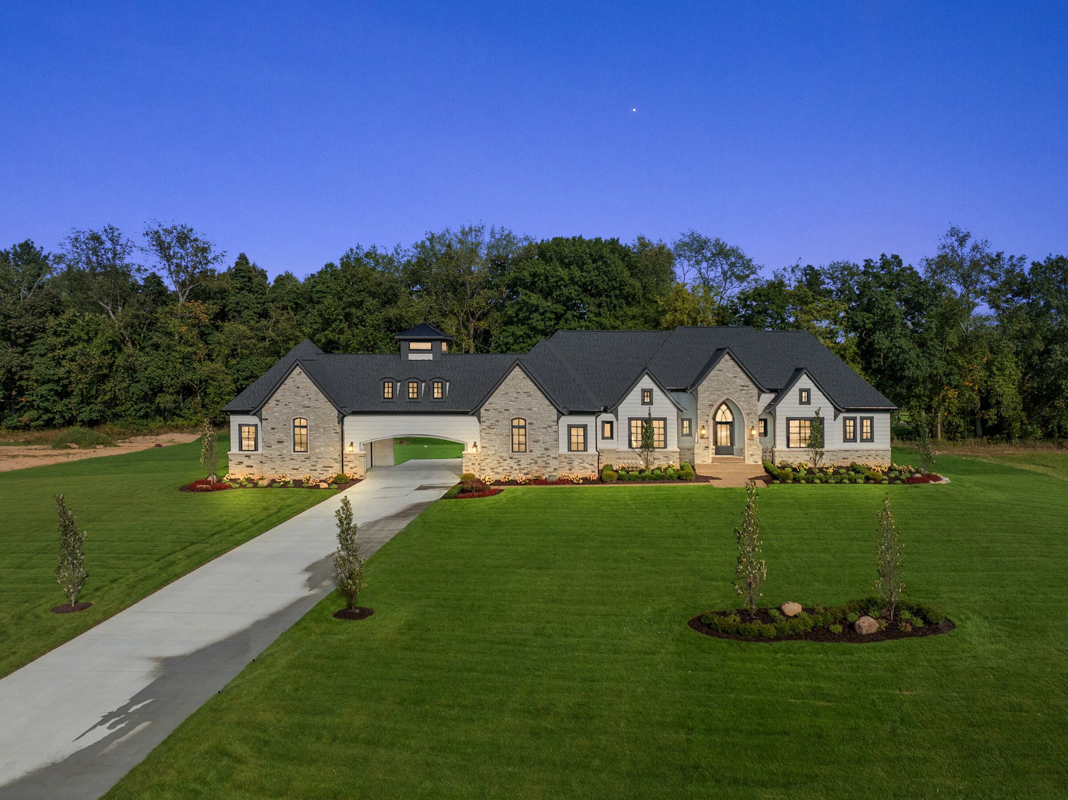 The Laurel, the Vitale show home at the Estates at Highland Hills, at dusk
